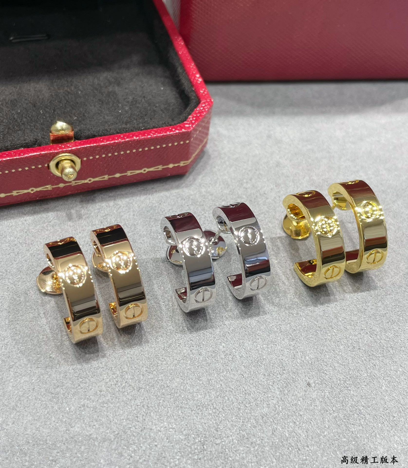 Ca*t*er Wide glossy LOVE Earrings