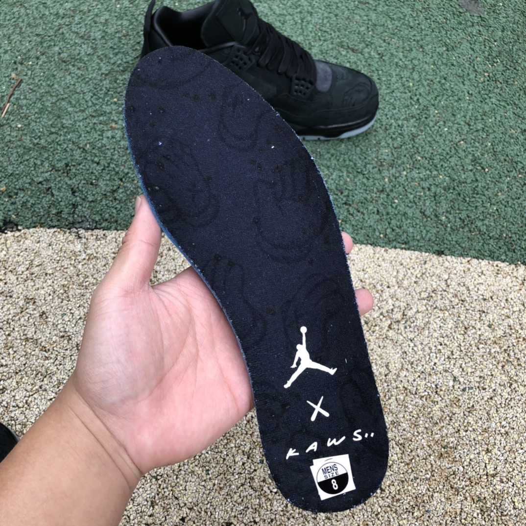 UA Jordan 4 Retro Kaws Black