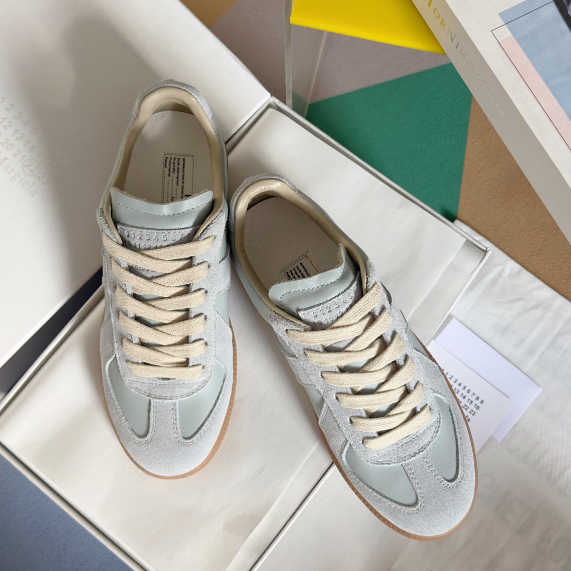 ua ma*s*n Ma*i*la mm6 sneakers